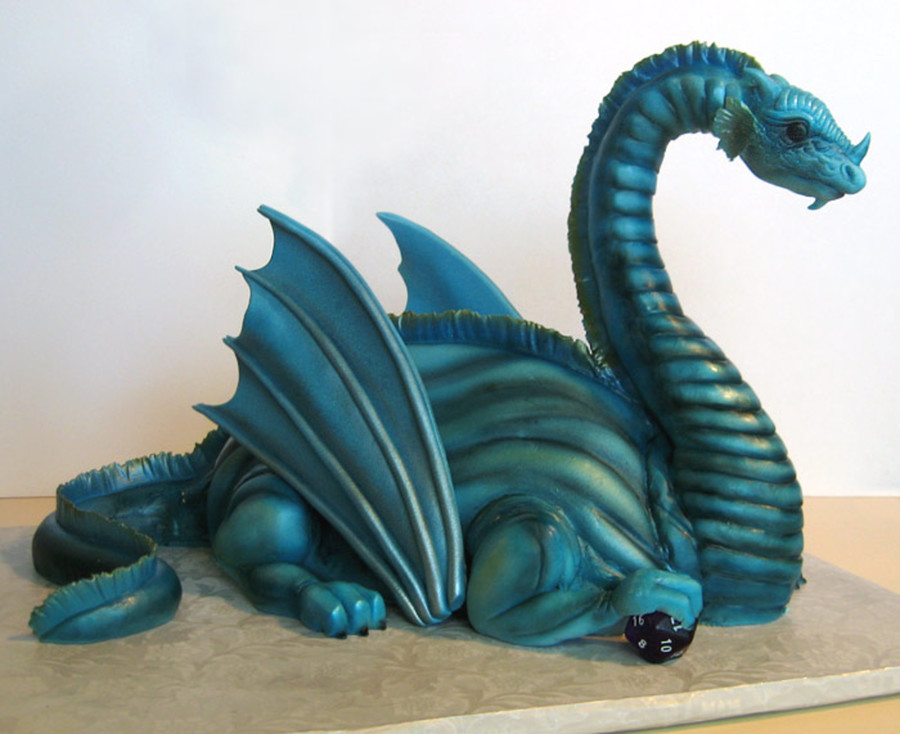 This is a truly inspired piece of edible art made as a groom's cake. I found this pictured at CakeCentral.com, along with a tutorial for those inclined to undertake recreating it. Massive props and kudos to the creator whom I could not identify! Dragon, groom, cake, wedding, inspired, original art