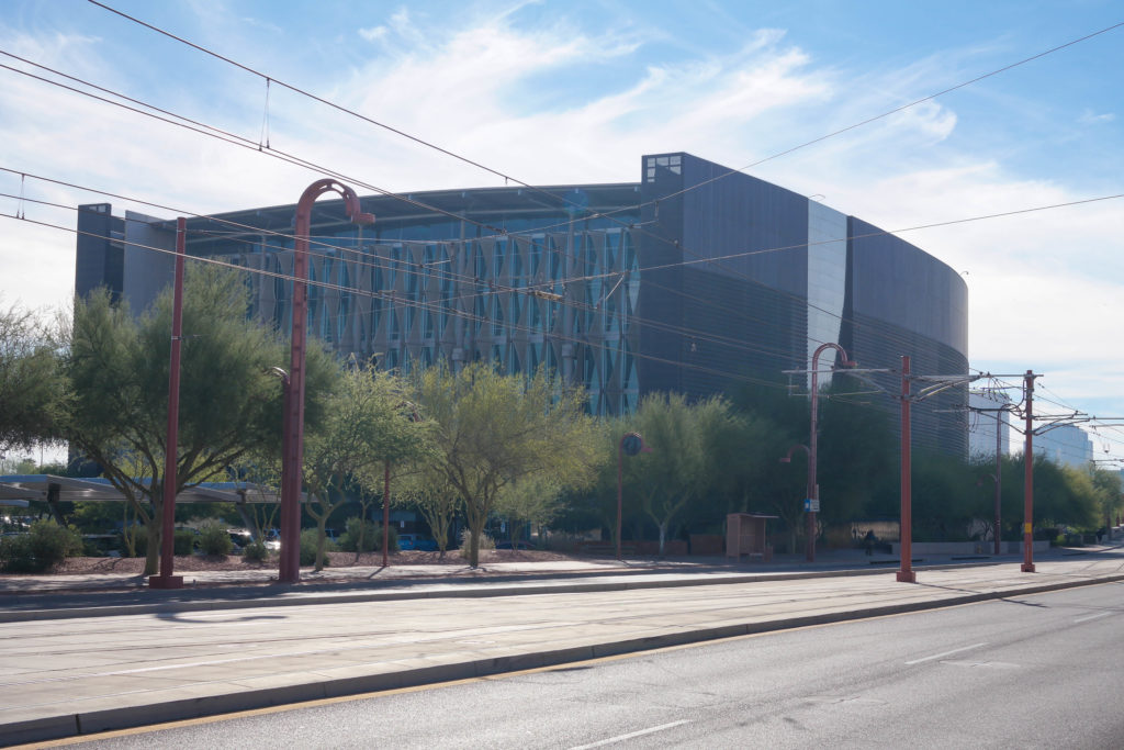 A street-side photograph of an industrial-looking building, the Burton Barr Central Library in Phoenix Arizona.