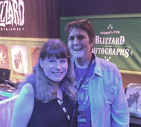 Photograph of Christie Golden and Liz Danforth at Blizzard's autograph booth, November 2018.